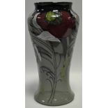 A contemporary Moorcroft Trial waisted baluster vase, tube lined with large red on a grey ground,