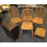 Four elm wheel back dining chairs; a small oak drop leaf occasional table;