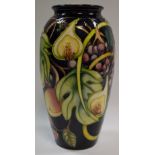 A contemporary Moorcroft Queens Choice ovoid vase, designed by Emma Bosson, tube lined with berries,