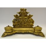 A gilt metal pen tray,decorated in putti,