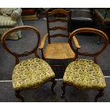 A pair of Victorian mahogany balloon back chairs carved horizontal splat,