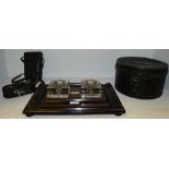 An early 20th century partners desk standish, in faux walnut and ebonised, presentation plaque,