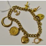 A 9ct charm bracelet, padlock lock, seven charms,