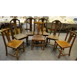 A set of four oak dining chairs; a Hepplewhite style oak dining chair;