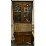 An early 20th Century oak bureau bookcase twin leaded doors,