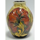 A contemporary Moorcroft Spanish pattern ovoid vase, tube lined with flowers and foliage, in red,