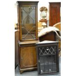 A mahogany wall mounted corner cabinet, stepped cornice, blind fretwork frieze,