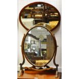 A mahogany dressing mirror, oval plate; an oval wall mirror,