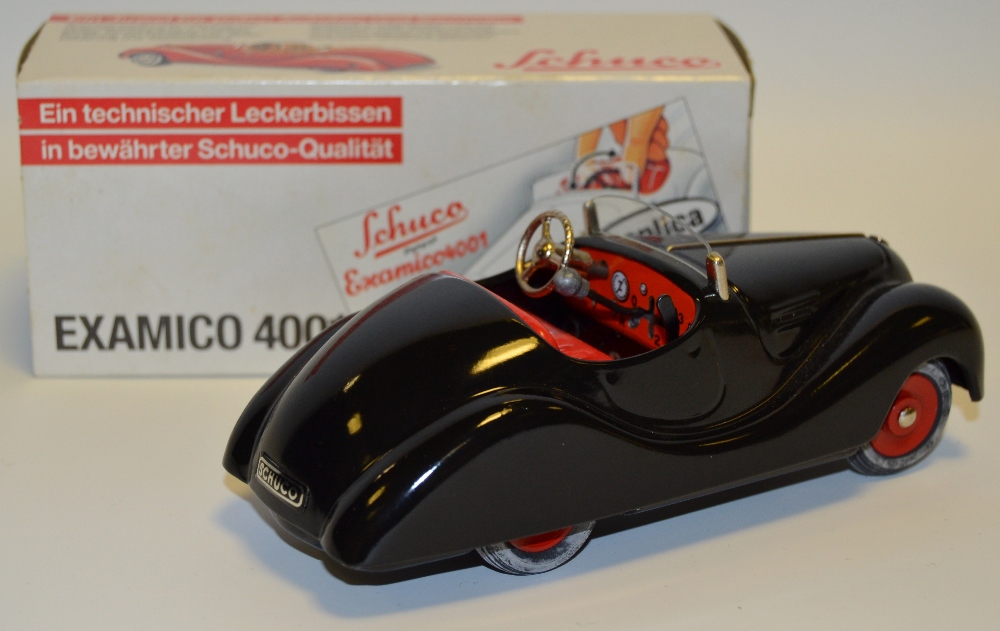 A Schuco Examico 4031 model clockwork car,