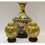 A pair of Cloisonne enamelled globular urns and covers.