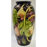 A contemporary Moorcroft Queens Choice ovoid vase, designed by Emma Bosson, tube lined with berries,