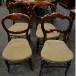 A pair of Victorian carved balloon back salon chairs;