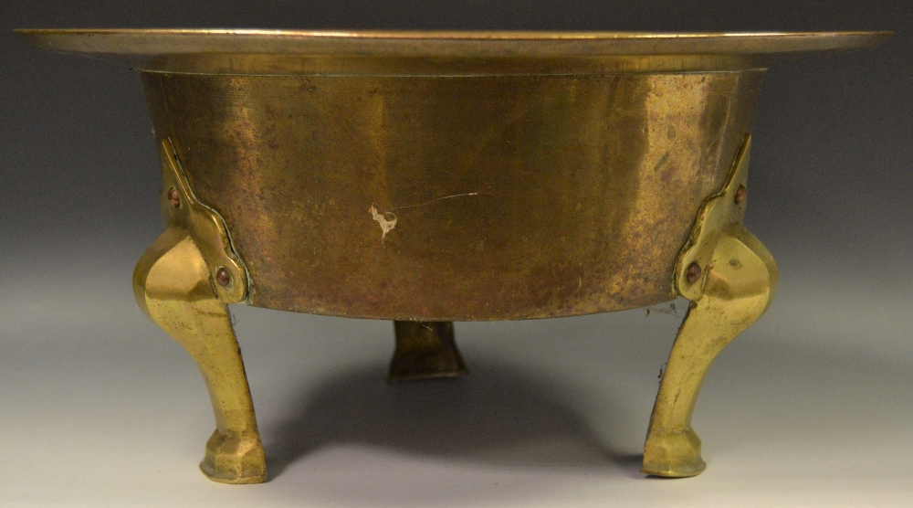 An Oriental bronze bowl with later brass legs