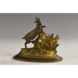 A 19th century dark patinated and parcel-gilt bronze table vesta,