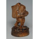 A 19th century Black Forest table vesta, carved as a bearded gnome holding a pick,