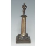 A 19th century dark patinated bronze desk thermometer, the pillar crested by a figure, rocky socle,