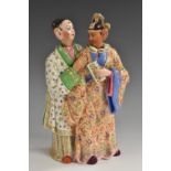 A 19th century Continental porcelain nodding figure group, in the Chinese taste,