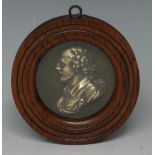 A 19th century brass portrait plaque, of William Shakespear, bust length in profile, 7cm diam,