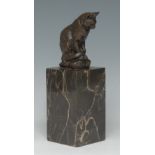 After Barye, a brown patinated animalier bronze, Chat assis (Seated Cat),