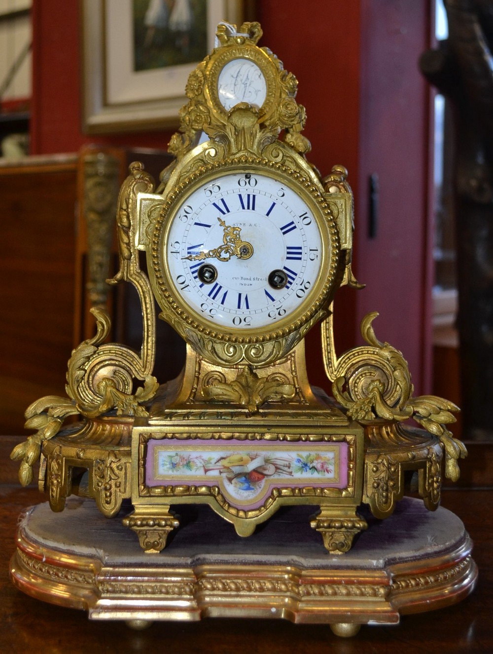 A 19th century gilt-metal mantel clock, circular dial inscribed Payne & Co, New Bond Street, London,