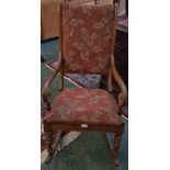 A Victorian mahogany rocking chair, padded back, scrolling open arms, padded seat,