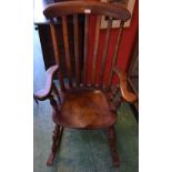 A Victorian style oak rocking chair