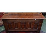 A carved oak blanket chest, panel front,