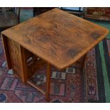 An early 20th century walnut dropleaf table