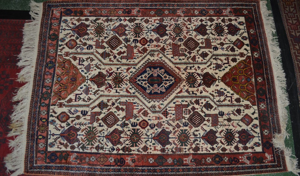 Carpets - a Persian style woollen rug, in shades of brown, blue, green and white, with birds,