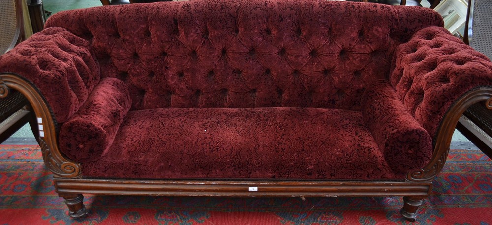 A William IV rosewood scroll end sofa, deep buttoned stuffed over upholstery,