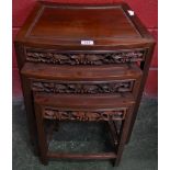 A Chinese hardwood nest of three tables,