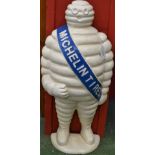 A cast metal door stop, as The Michelin Man, Bibendum,