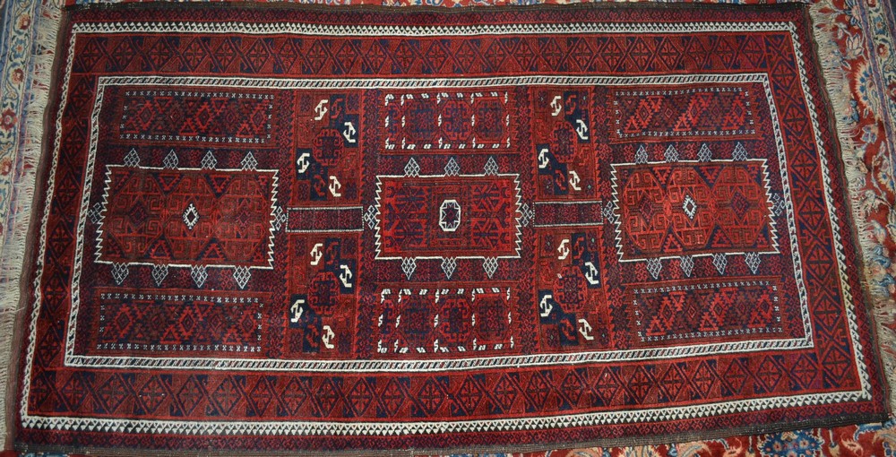 Carpets - a Persian style woollen rug, in shades of red, blue and white,