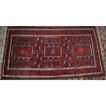 Carpets - a Persian style woollen rug, in shades of red, blue and white,