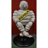 A cast metal figure of The Michelin Man, Bibendum,