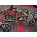 A child's wooden cart, steering pedal, metal bound wheels,