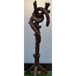 A hardwood sculpture, carved as a serpent entwined within a branch,