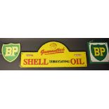 A cast metal advertising plaque, Shell Lubricating Oil, domed, 50cm wide; others, smaller,