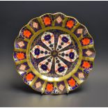 A Royal Crown Derby 1128 Old Imari pattern shaped circular plate, second quality,