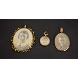 Jewellery - an Edwardian double sided oval rose metal photographic pendant; another, smaller,