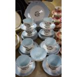 A Royal Stafford White Lady pattern tea service including side plates, cake plate, cups and saucers,