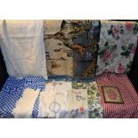 Textiles - floral quilted fabric; table cloth; embroidered runners and photograph frame; lace;