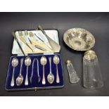 A set of six silver teaspoons with sugar tongs, cased,