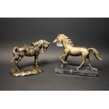 A cast metal model of a trotting horse, marble base; another, standing,