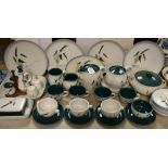 A Denby Greenwheat part dinner and tea service comprising dinner plates, side plates, bowls, teapot,