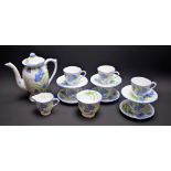 A Delphine china painted floral six setting coffee service, comprising coffee pot, cups, saucers,