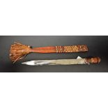 Tribal Art - a Mandinka knife, 33cm pointed blade, leatherwork scabbard and grip, 53cm long overall,