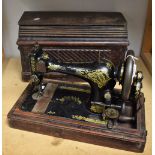 A vintage hand operated Singer sewing machine,