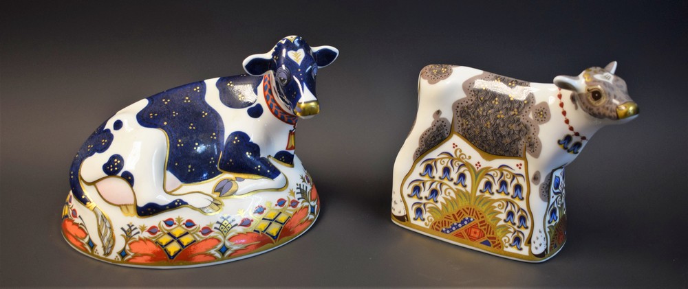 A Royal Crown Derby paperweight, Friesian Cow, Buttercup, gold stopper, boxed; another,