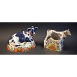 A Royal Crown Derby paperweight, Friesian Cow, Buttercup, gold stopper, boxed; another,